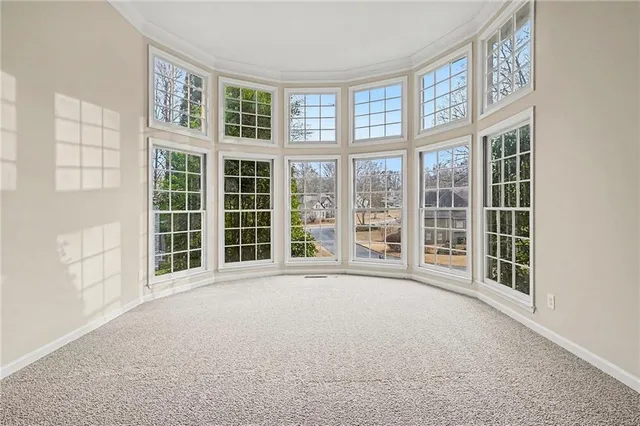 a view of an empty room with a large window