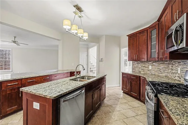 a kitchen with a stove and a sink