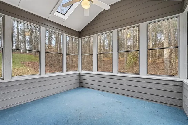 a view of lot of window and front door