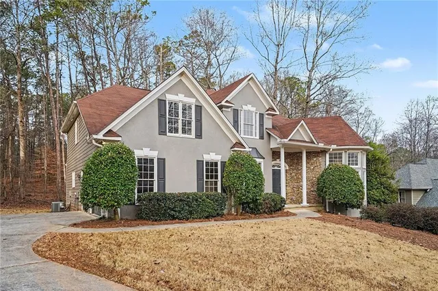 front view of a house with a yard