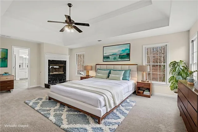 a bedroom with a bed dresser and a couch