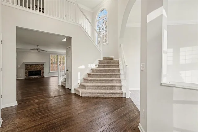 a view of entryway and hall with wooden floor