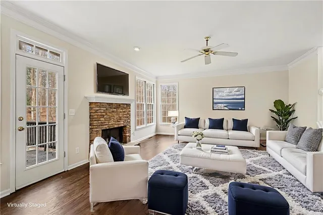 a living room with furniture fireplace and a flat screen tv