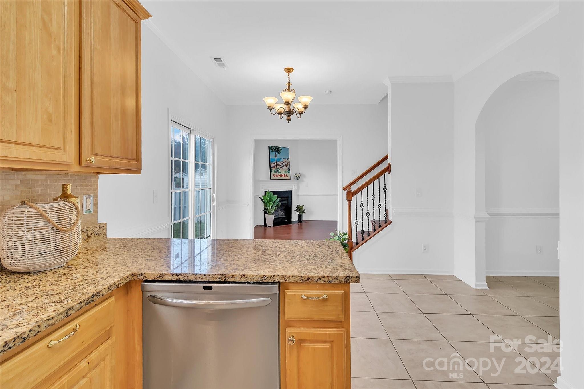 1004 Kipling Court Indian Trail, NC 28079 - Photo 15 of 42 a kitchen with granite countertop a sink and a stove