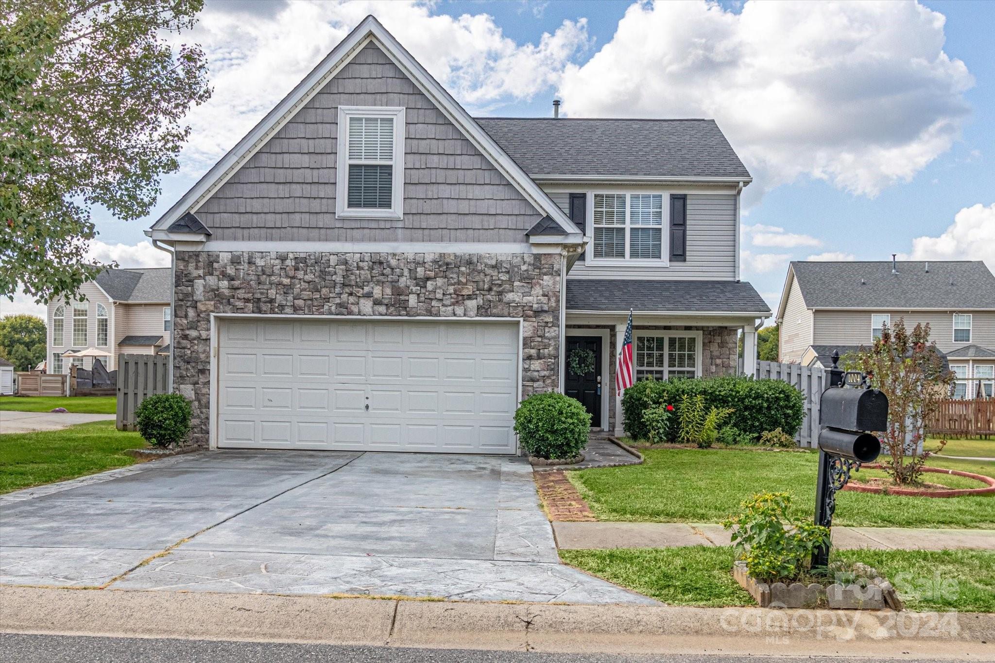1004 Kipling Court Indian Trail, NC 28079 - Photo 2 of 42 a front view of a house with a yard and garage