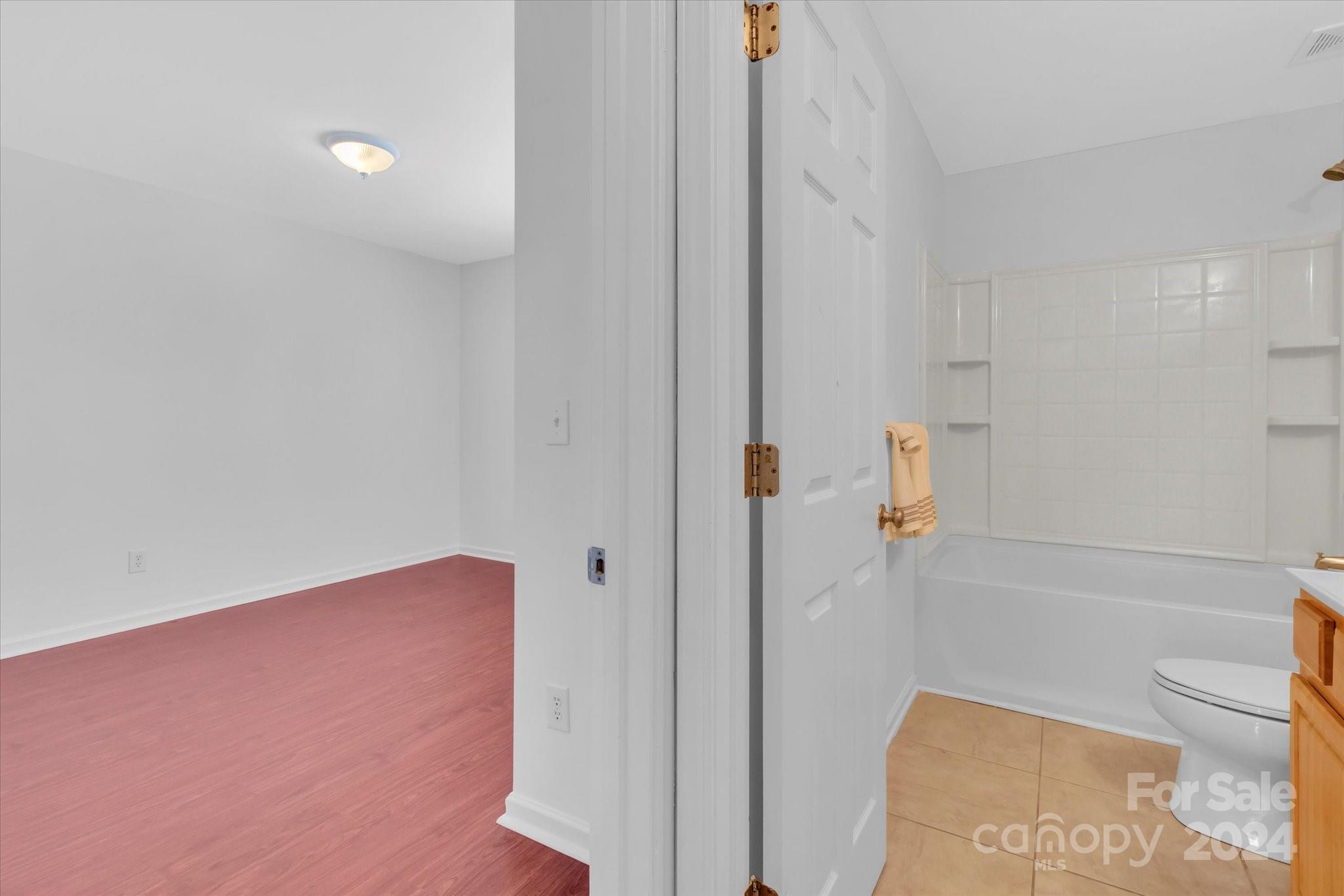 1004 Kipling Court Indian Trail, NC 28079 - Photo 31 of 42 a bathroom with a bathtub and toilet