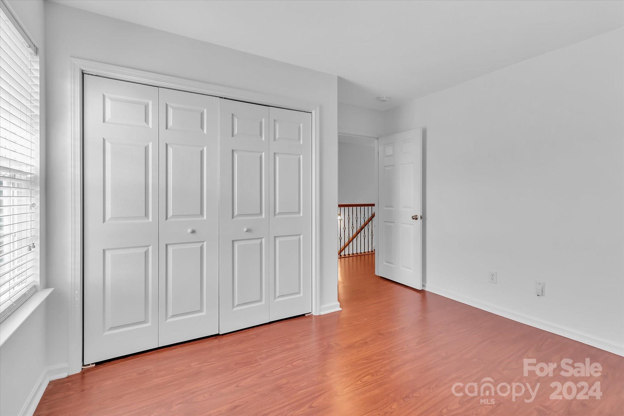 1004 Kipling Court Indian Trail, NC 28079 - Photo 33 of 42 a view of an empty room and wooden floor