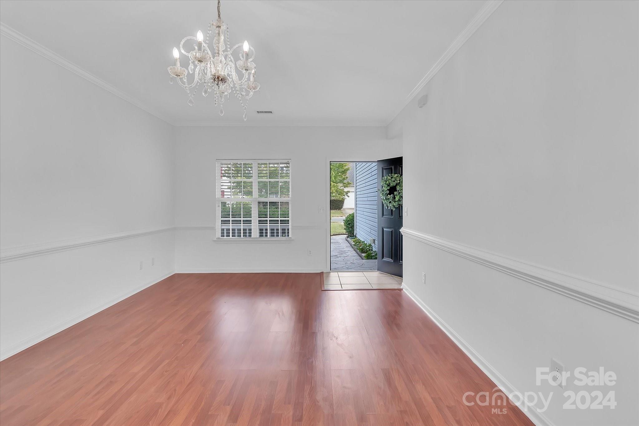 1004 Kipling Court Indian Trail, NC 28079 - Photo 8 of 42 wooden floor in an empty room with a window