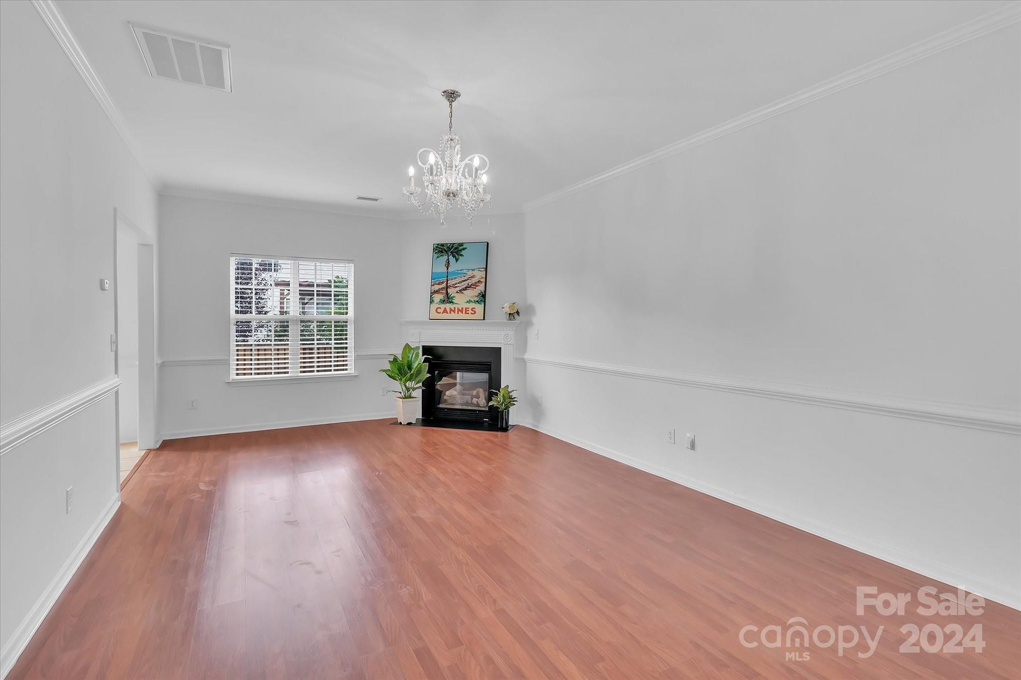 1004 Kipling Court Indian Trail, NC 28079 - Photo 9 of 42 wooden floor in an empty room with a window