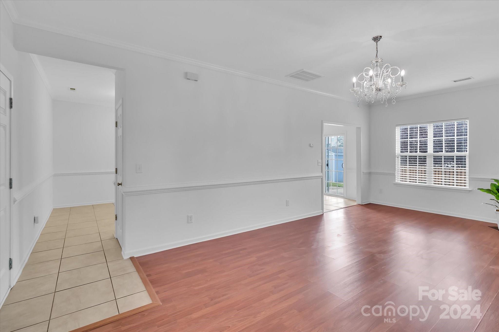 1004 Kipling Court Indian Trail, NC 28079 - Photo 10 of 42 wooden floor in an empty room with a window