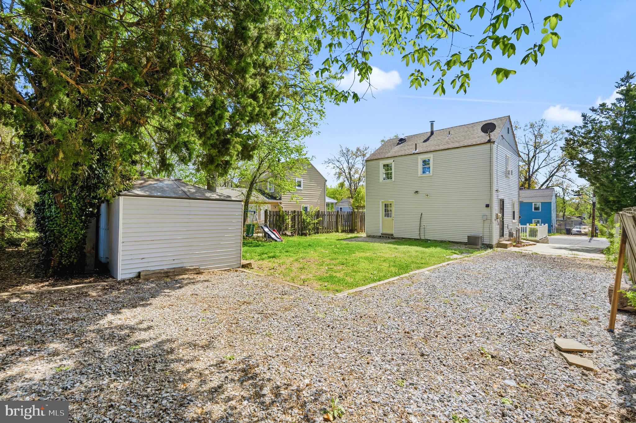 7204 East Inwood Street Landover, MD 20785 - Photo 20 of 24 a view of a house with a yard and garage
