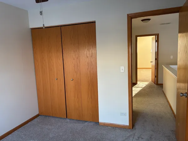 a view of a bathroom with closet area