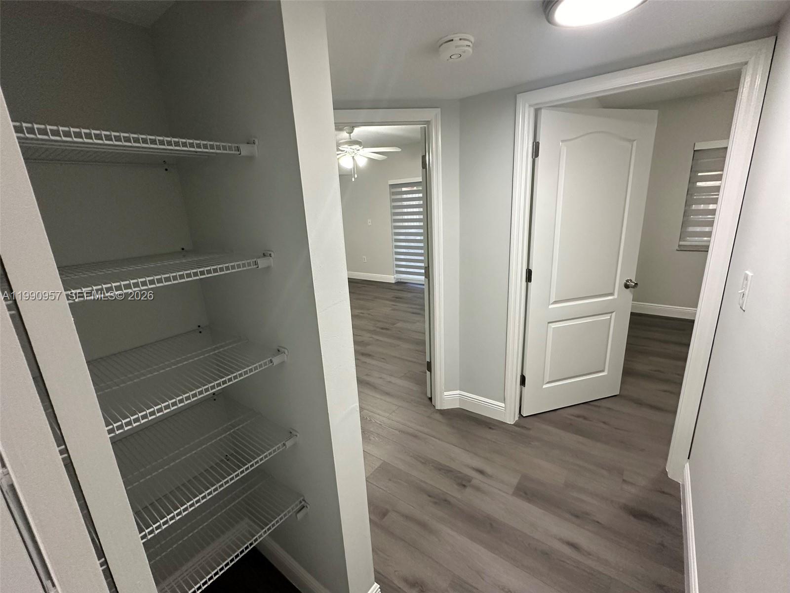 12005 Southwest 14th Street, Unit 403D Miami, FL 33184 - Photo 14 of 26 a view of an empty walk in closet