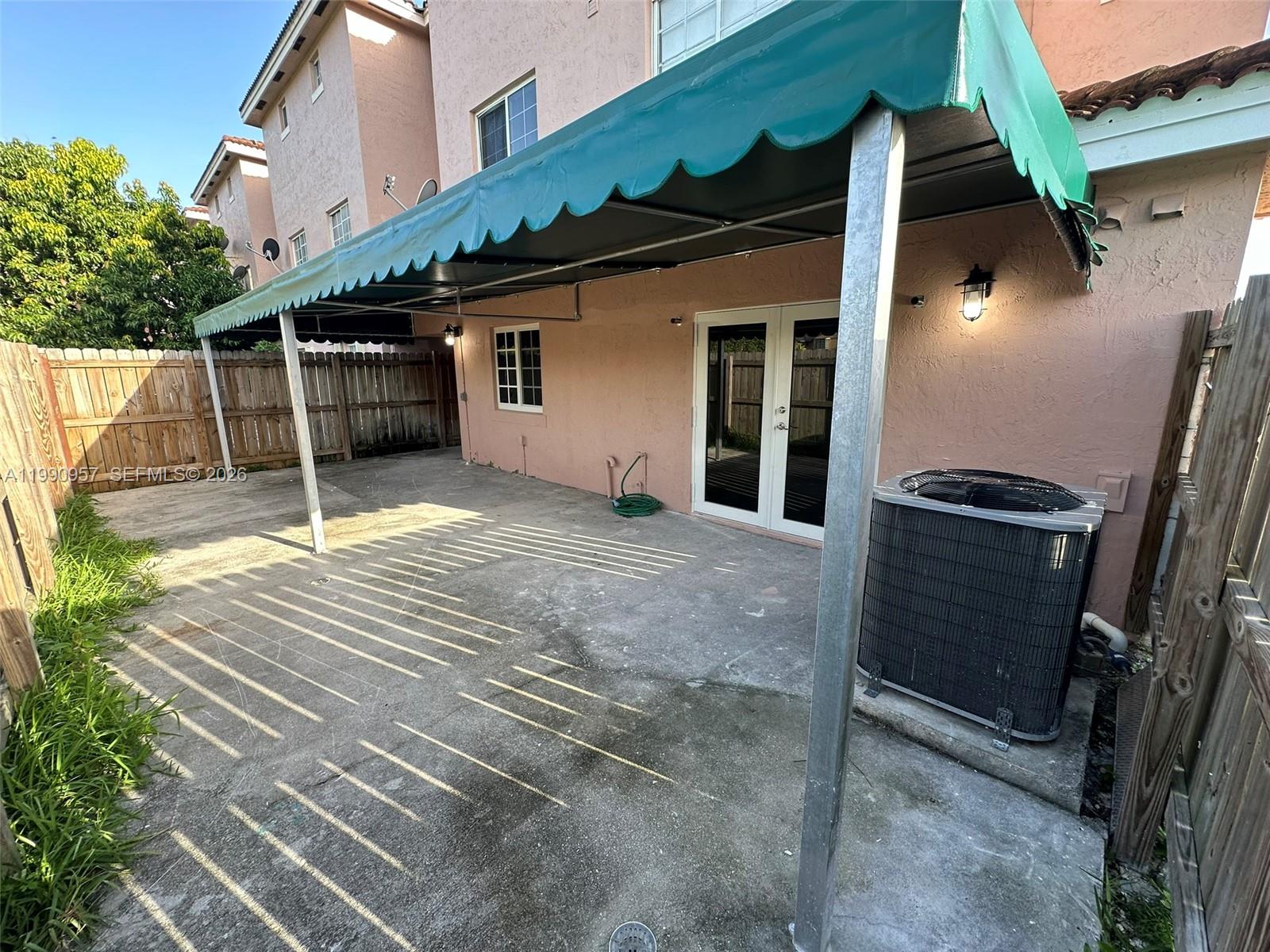 12005 Southwest 14th Street, Unit 403D Miami, FL 33184 - Photo 23 of 26 a backyard of a house