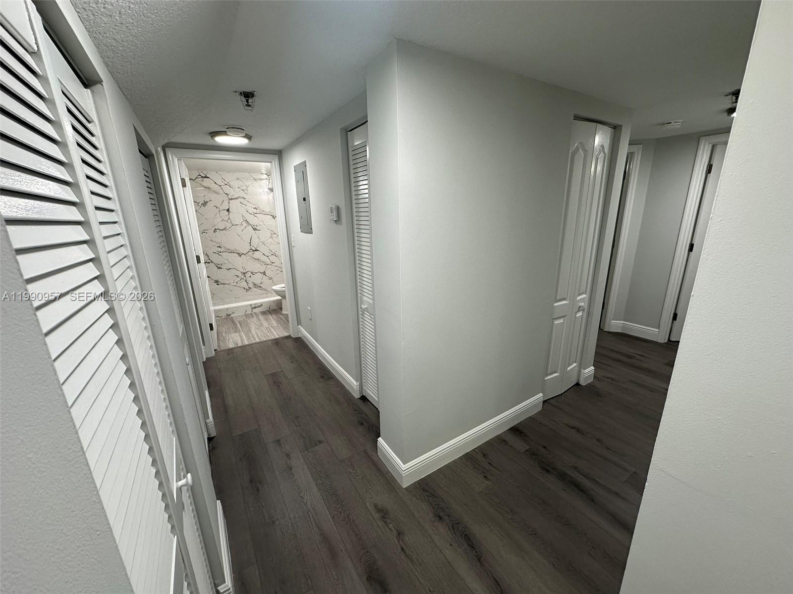 12005 Southwest 14th Street, Unit 403D Miami, FL 33184 - Photo 7 of 26 wooden floor in an empty room