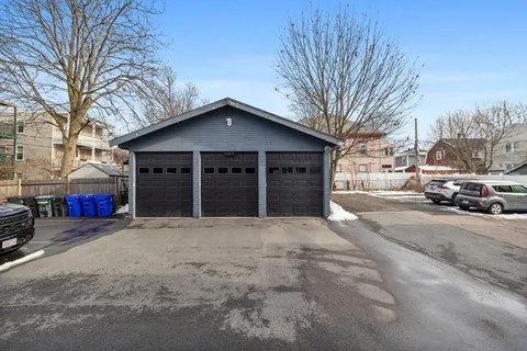 a front view of a building with parking space and parking space