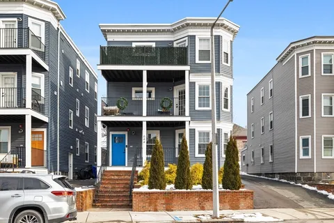 a front view of a building with a glass windows