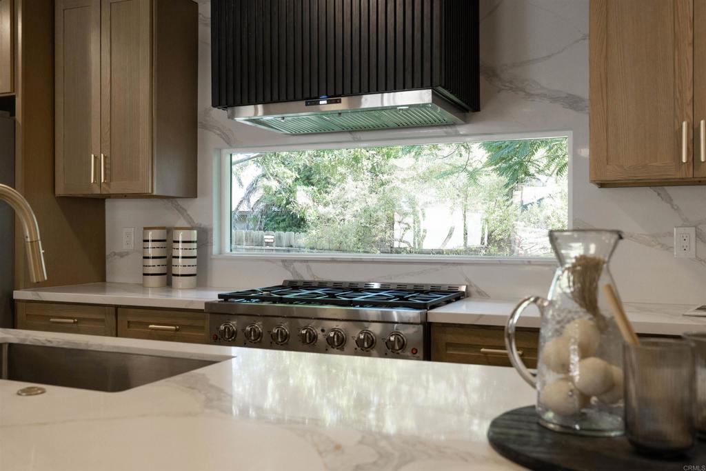 2275 Ivy Road Oceanside, CA 92054 - Photo 11 of 45 a kitchen with granite countertop a stove and a sink