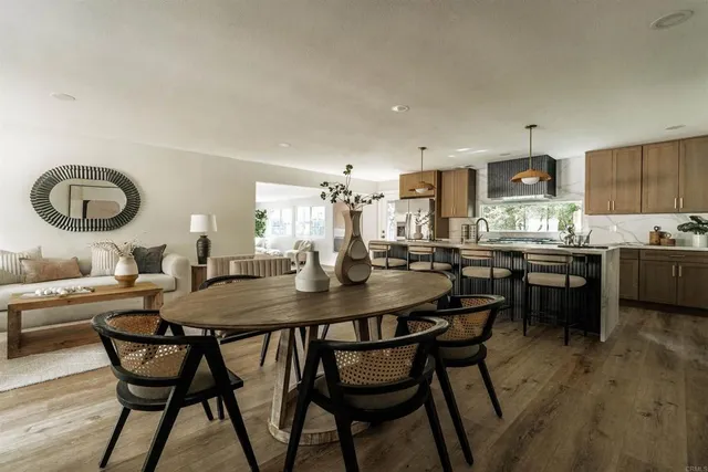 a kitchen with a table and chairs in it