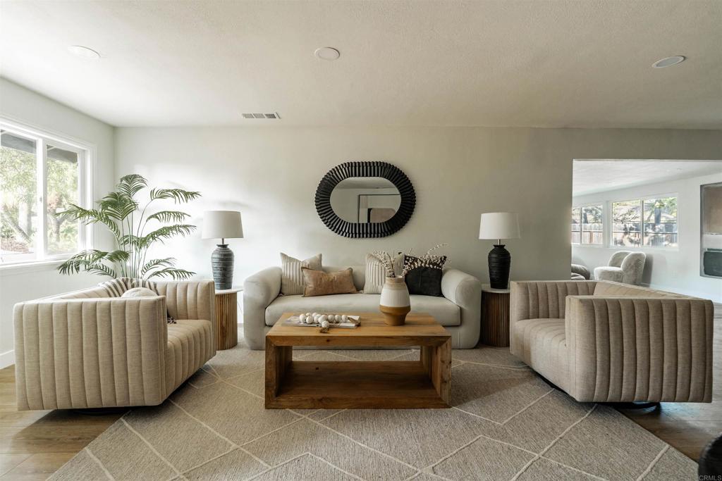 2275 Ivy Road Oceanside, CA 92054 - Photo 22 of 45 a living room with furniture and a large window