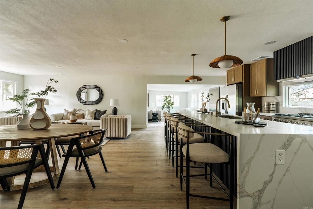 2275 Ivy Road Oceanside, CA 92054 - Photo 24 of 45 a kitchen with a table and chairs in it