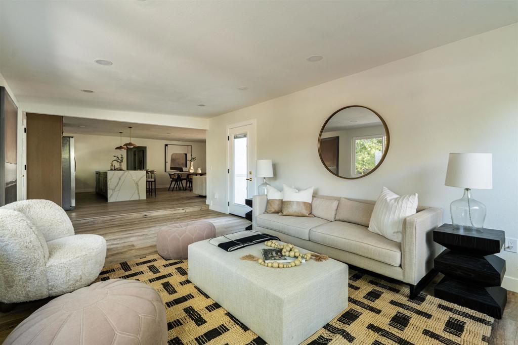 2275 Ivy Road Oceanside, CA 92054 - Photo 26 of 45 a living room with furniture a mirror and a lamp