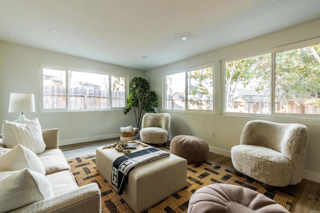 2275 Ivy Road Oceanside, CA 92054 - Photo 27 of 45 a living room with furniture and a large window