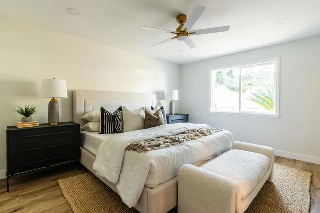 a bedroom with bed and window