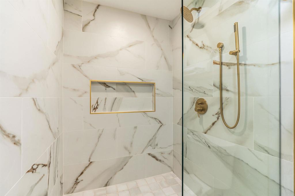 2275 Ivy Road Oceanside, CA 92054 - Photo 33 of 45 a bathroom with a glass shower door