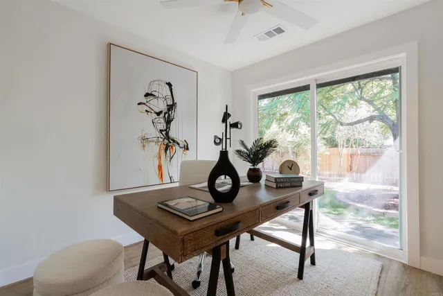 a view of a workspace with furniture