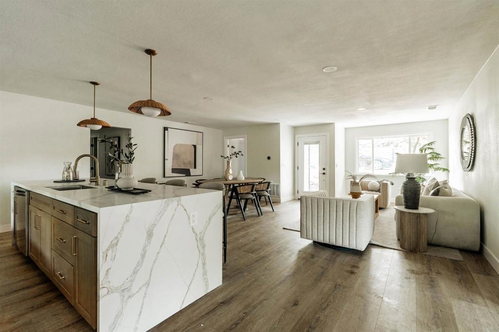 2275 Ivy Road Oceanside, CA 92054 - Photo 6 of 45 a kitchen with stainless steel appliances granite countertop a sink dishwasher and a stove with wooden floor