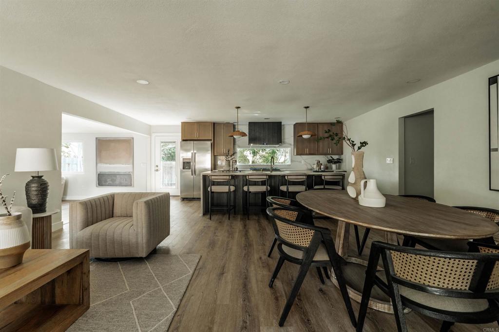 2275 Ivy Road Oceanside, CA 92054 - Photo 8 of 45 a living room with furniture and kitchen view