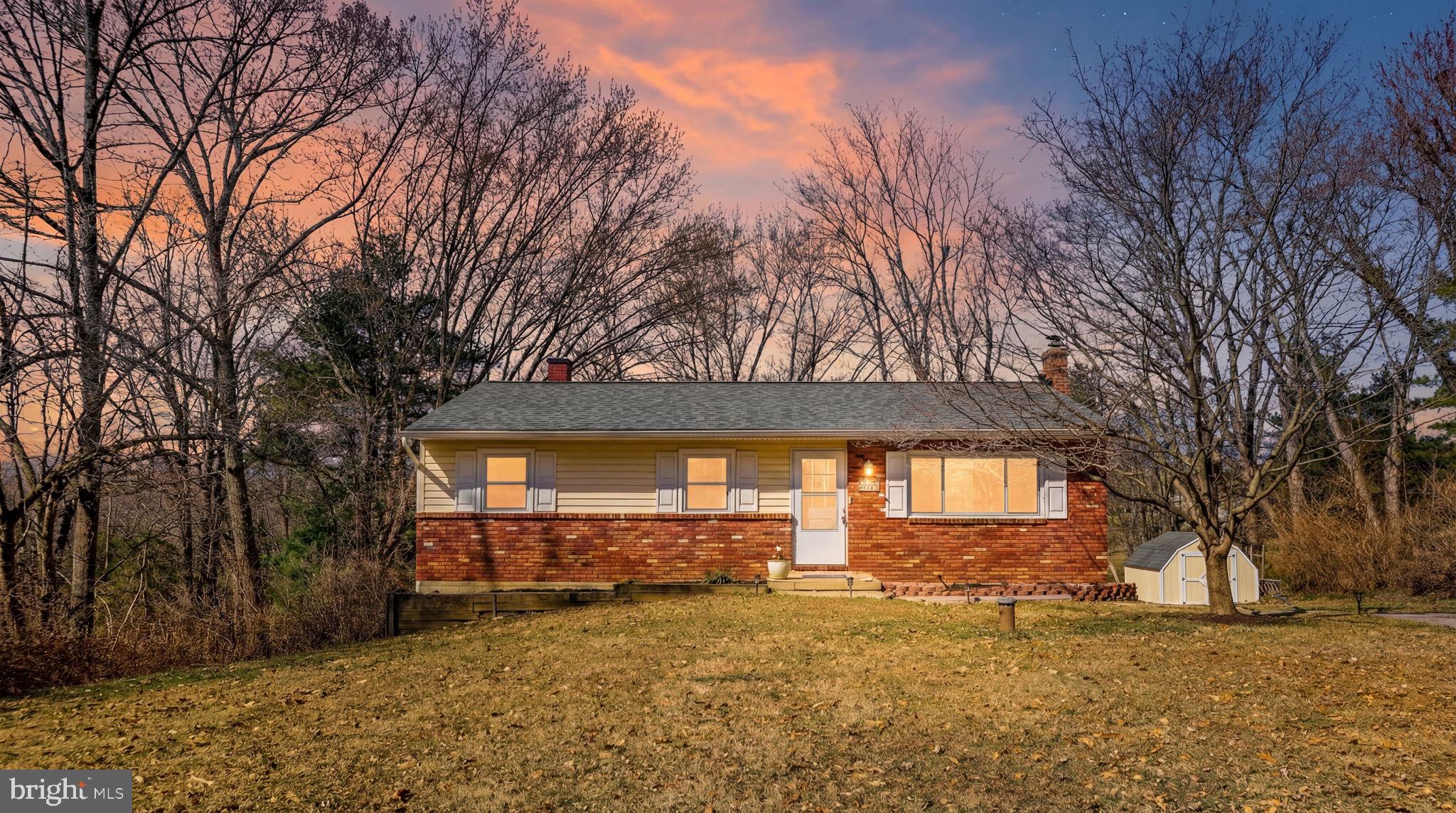 a view of a house with a snow in the yard