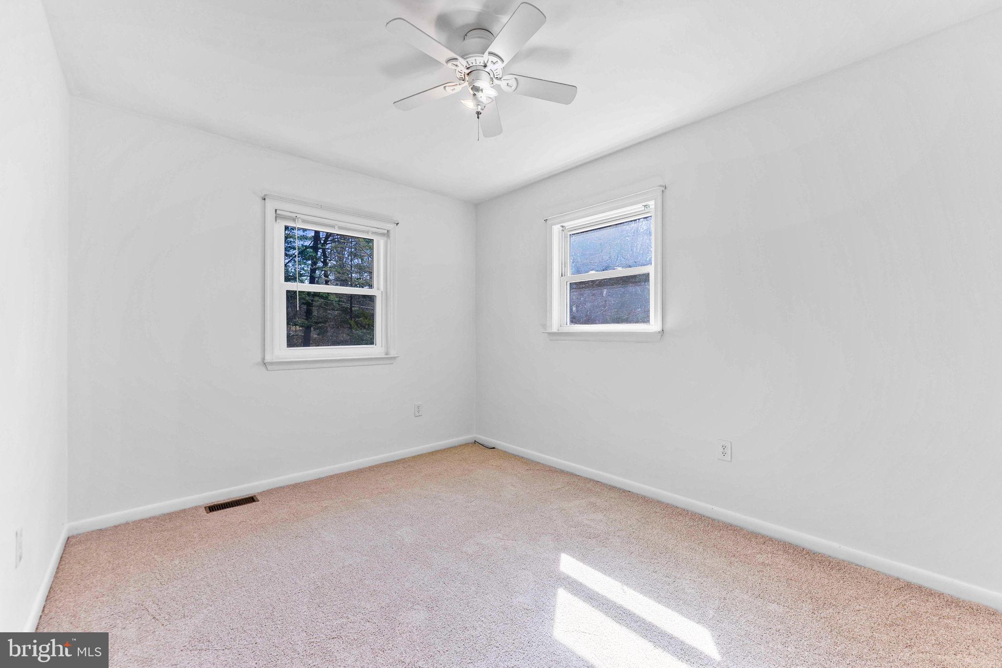 612 Ridge Road Finksburg, MD 21048 - Photo 29 of 39 an empty room with a window and a fan