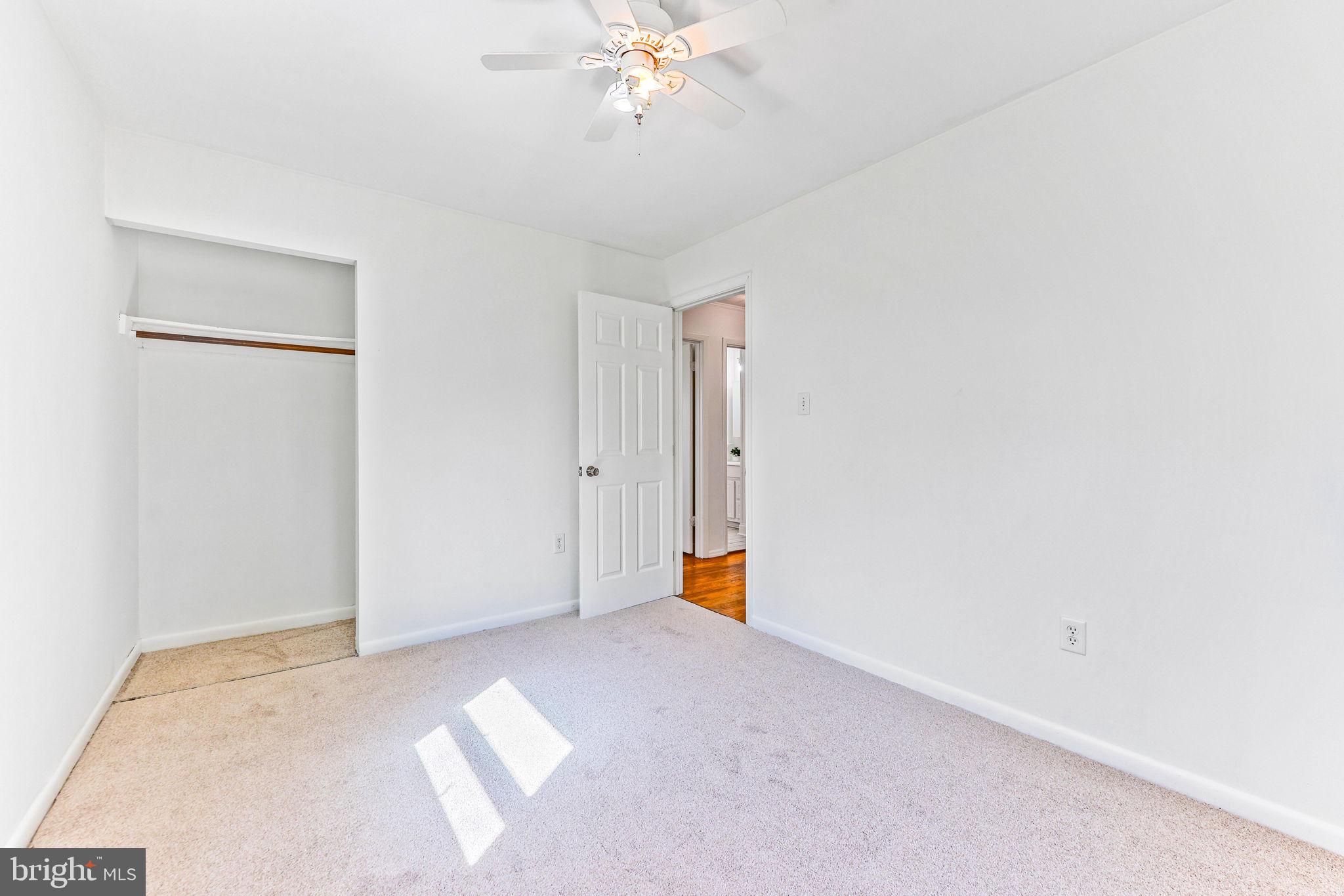 612 Ridge Road Finksburg, MD 21048 - Photo 31 of 39 a view of an empty room with a chandelier fan