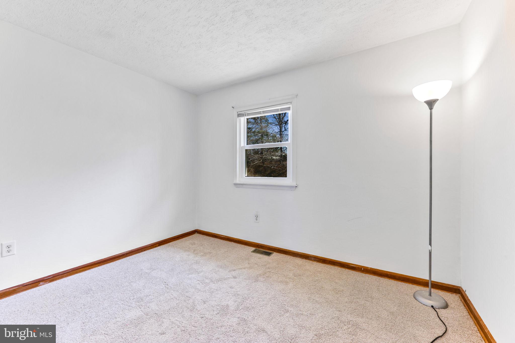 612 Ridge Road Finksburg, MD 21048 - Photo 32 of 39 an empty room with a workbench