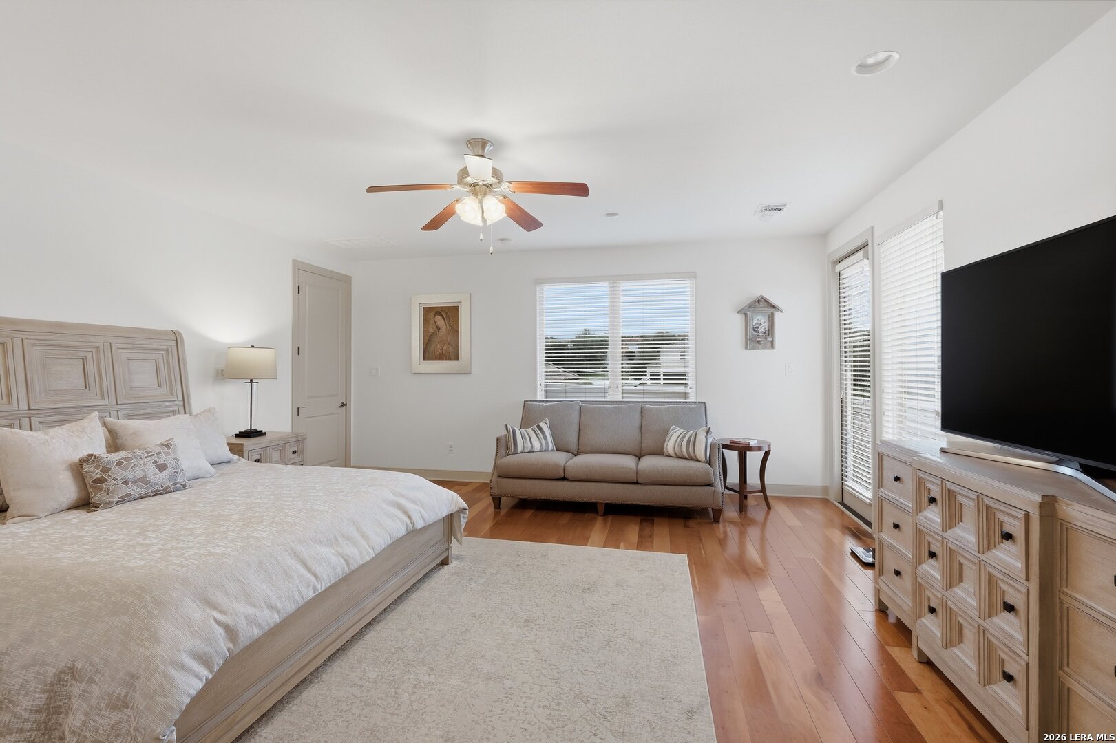426 Legacy Ridge San Antonio, TX 78258 - Photo 16 of 38 a bedroom with furniture and a flat screen tv