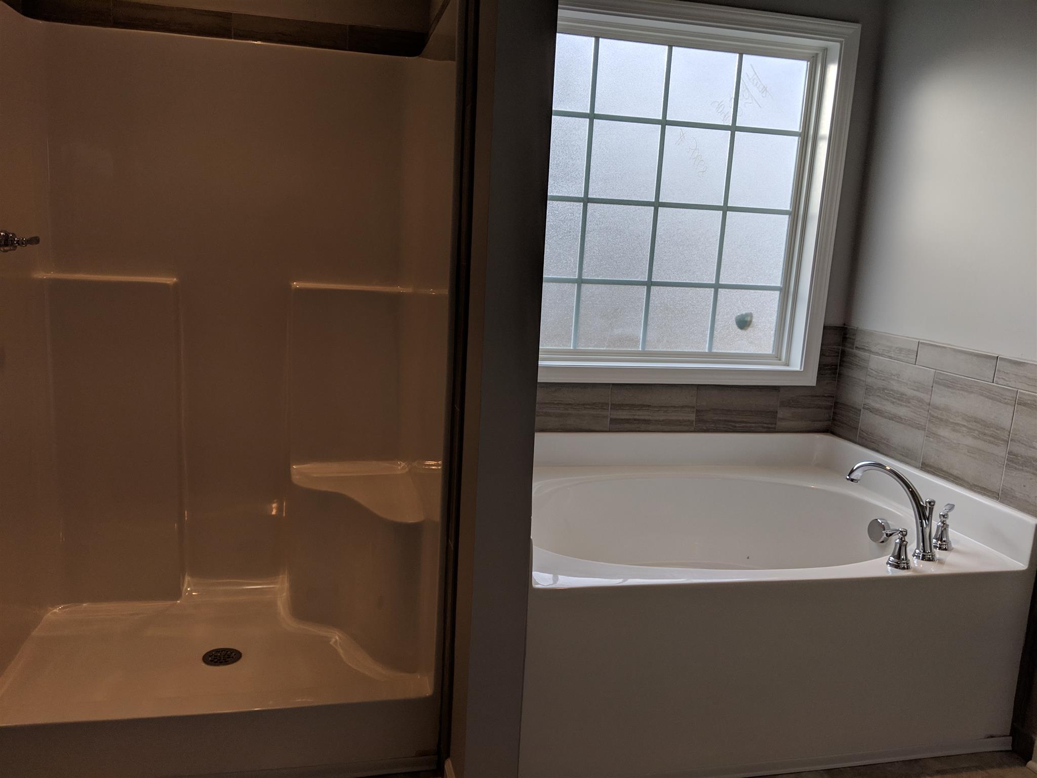 709 Mitscher Drive Spring Hill, TN 37174 - Photo 9 of 27 a bathroom with a bathtub
