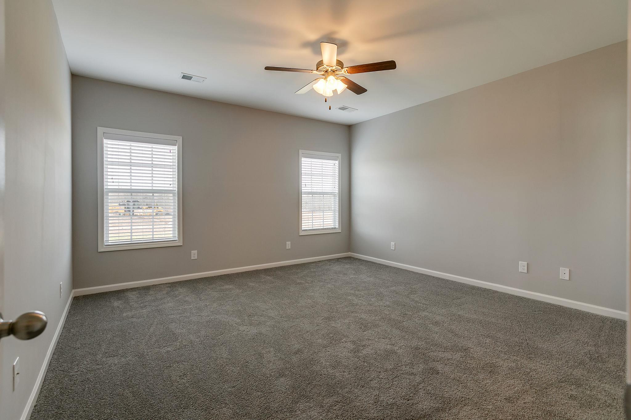 709 Mitscher Drive Spring Hill, TN 37174 - Photo 12 of 27 an empty room with windows and fan