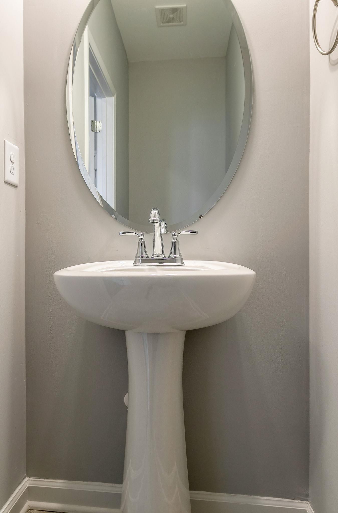 709 Mitscher Drive Spring Hill, TN 37174 - Photo 16 of 27 a bathroom with a sink and a mirror