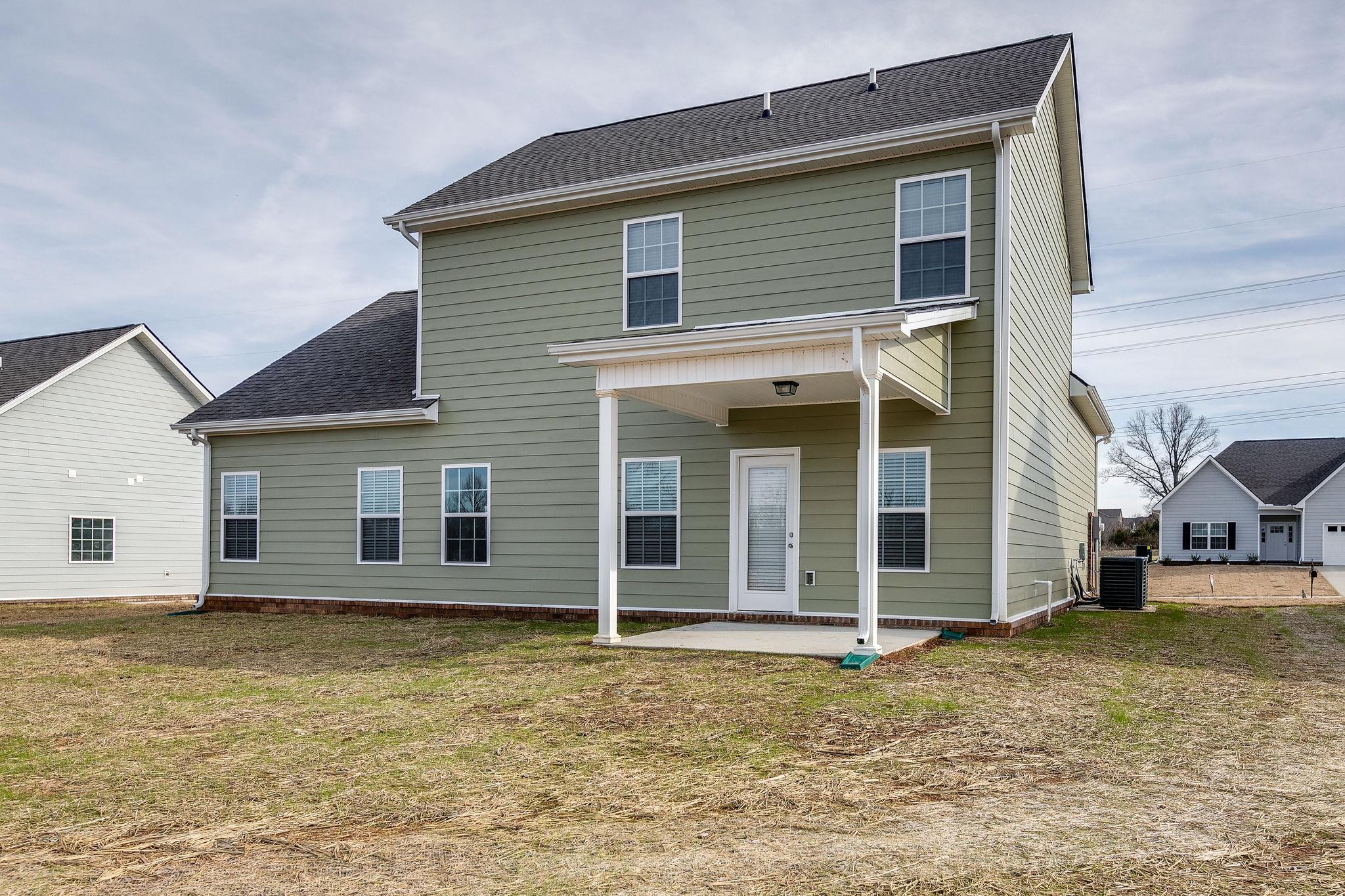 709 Mitscher Drive Spring Hill, TN 37174 - Photo 23 of 27 a view of a house with a backyard