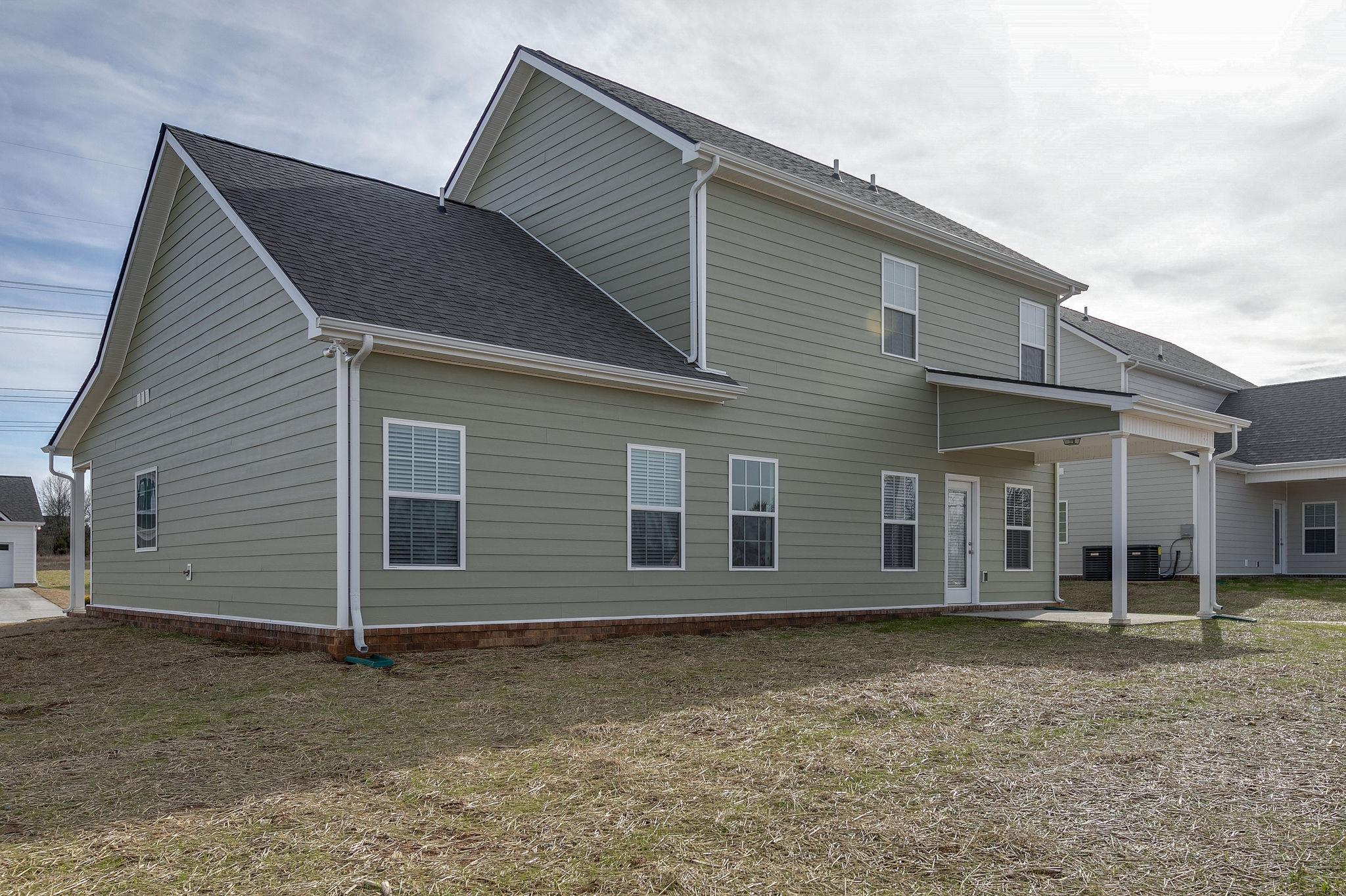 709 Mitscher Drive Spring Hill, TN 37174 - Photo 25 of 27 a house with a yard