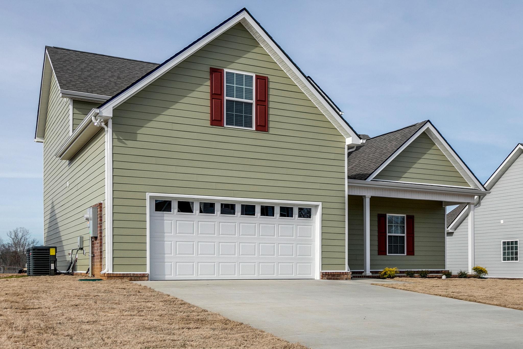 709 Mitscher Drive Spring Hill, TN 37174 - Photo 26 of 27 a view of a house with a garage