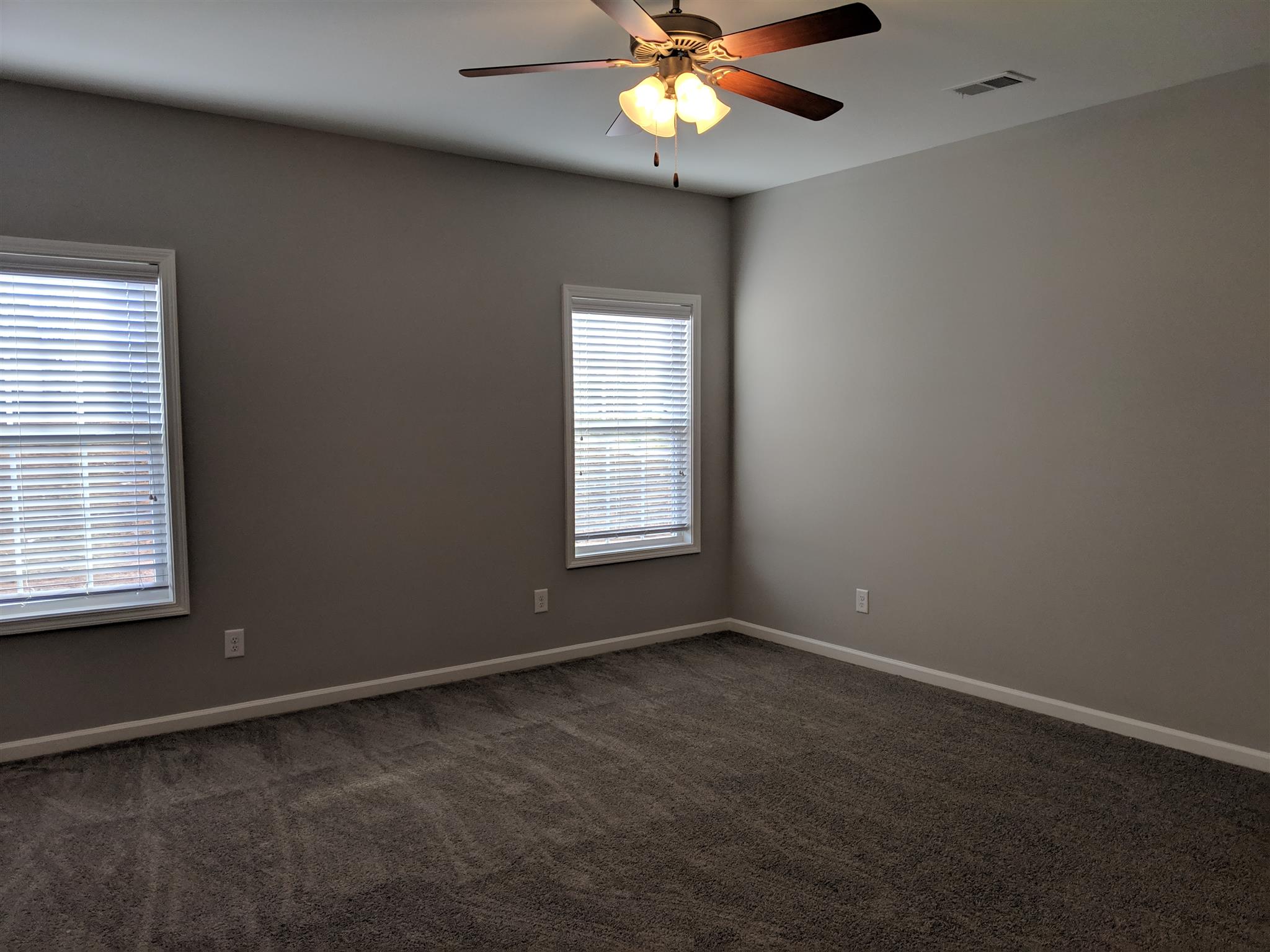 709 Mitscher Drive Spring Hill, TN 37174 - Photo 7 of 27 an empty room with a window and a fan