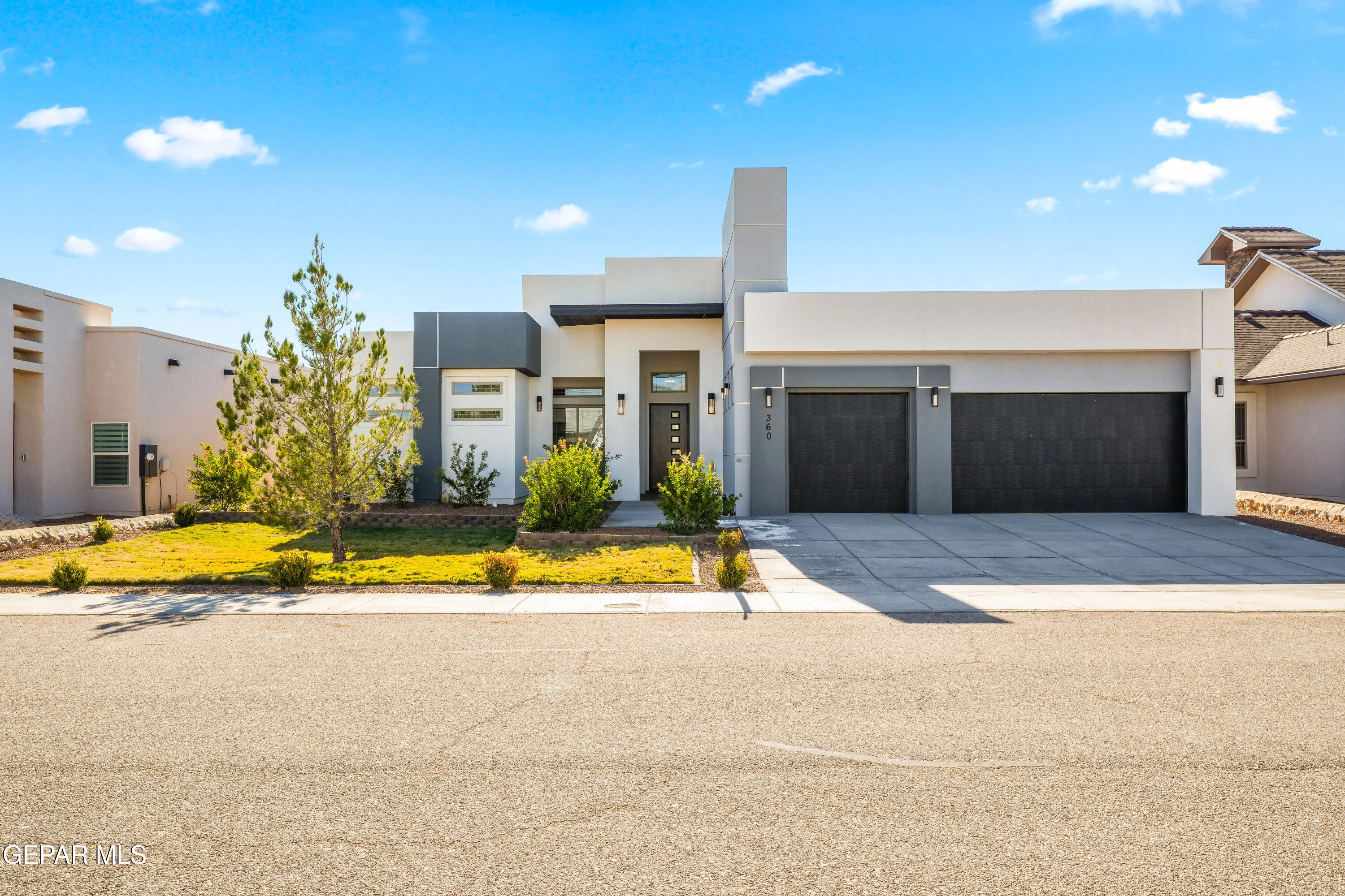 a view of a house with swimming pool and a yard
