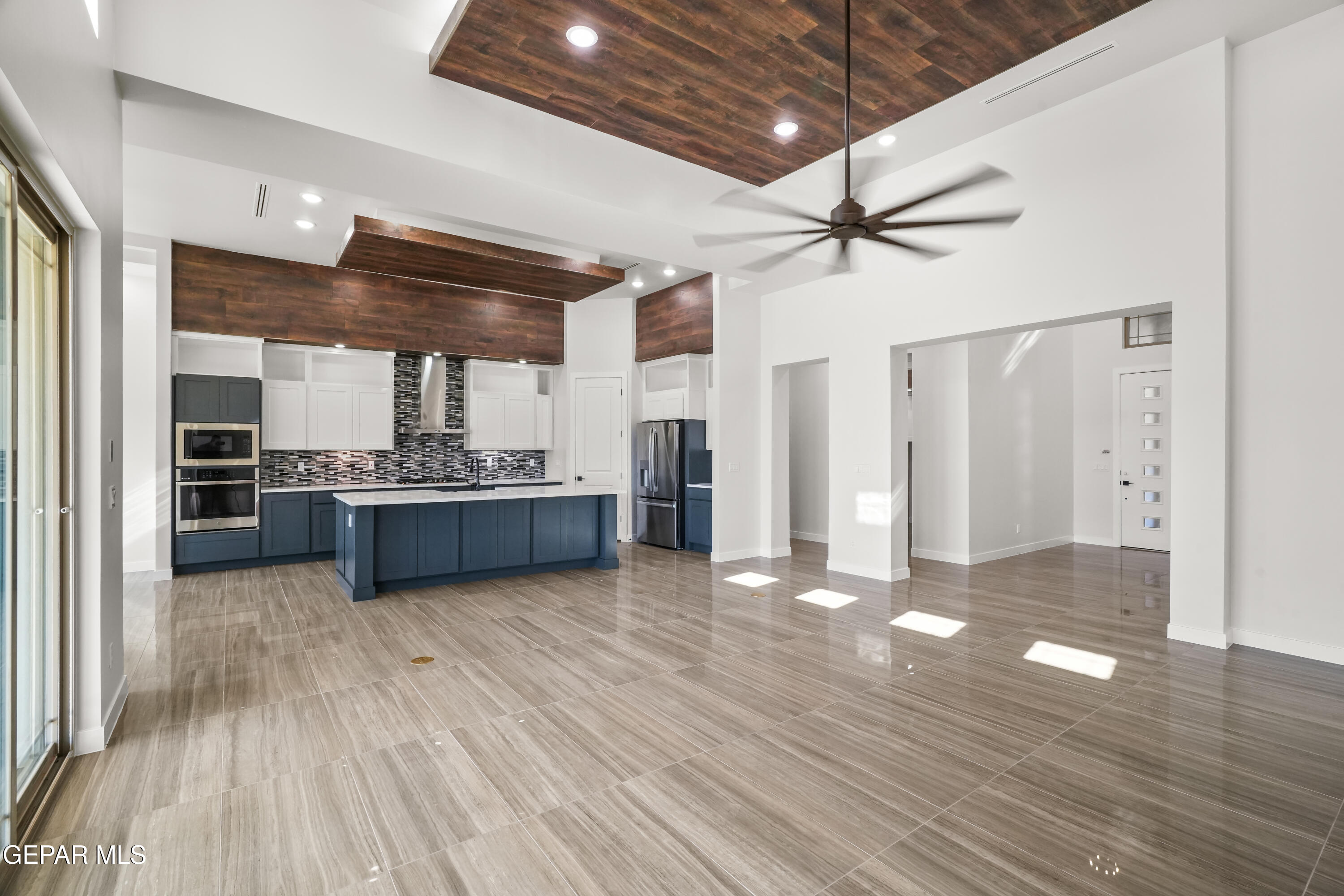 360 Rio De Jazmin Circle El Paso, TX 79932 - Photo 11 of 66 a view of a kitchen with a sink and a refrigerator
