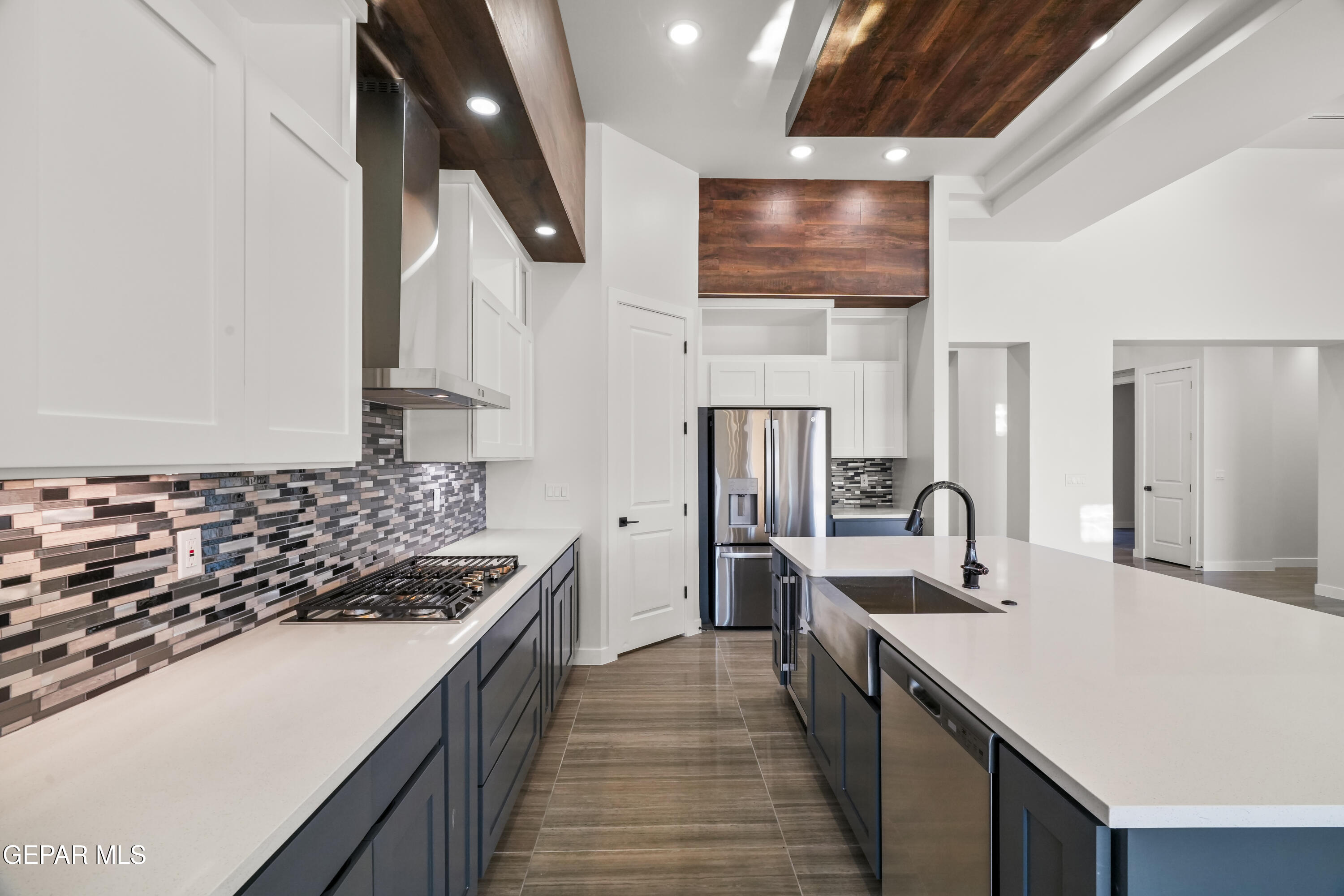 360 Rio De Jazmin Circle El Paso, TX 79932 - Photo 17 of 66 a kitchen with stainless steel appliances granite countertop a sink stove and refrigerator