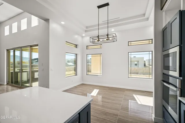 a view of hallway with wooden floor