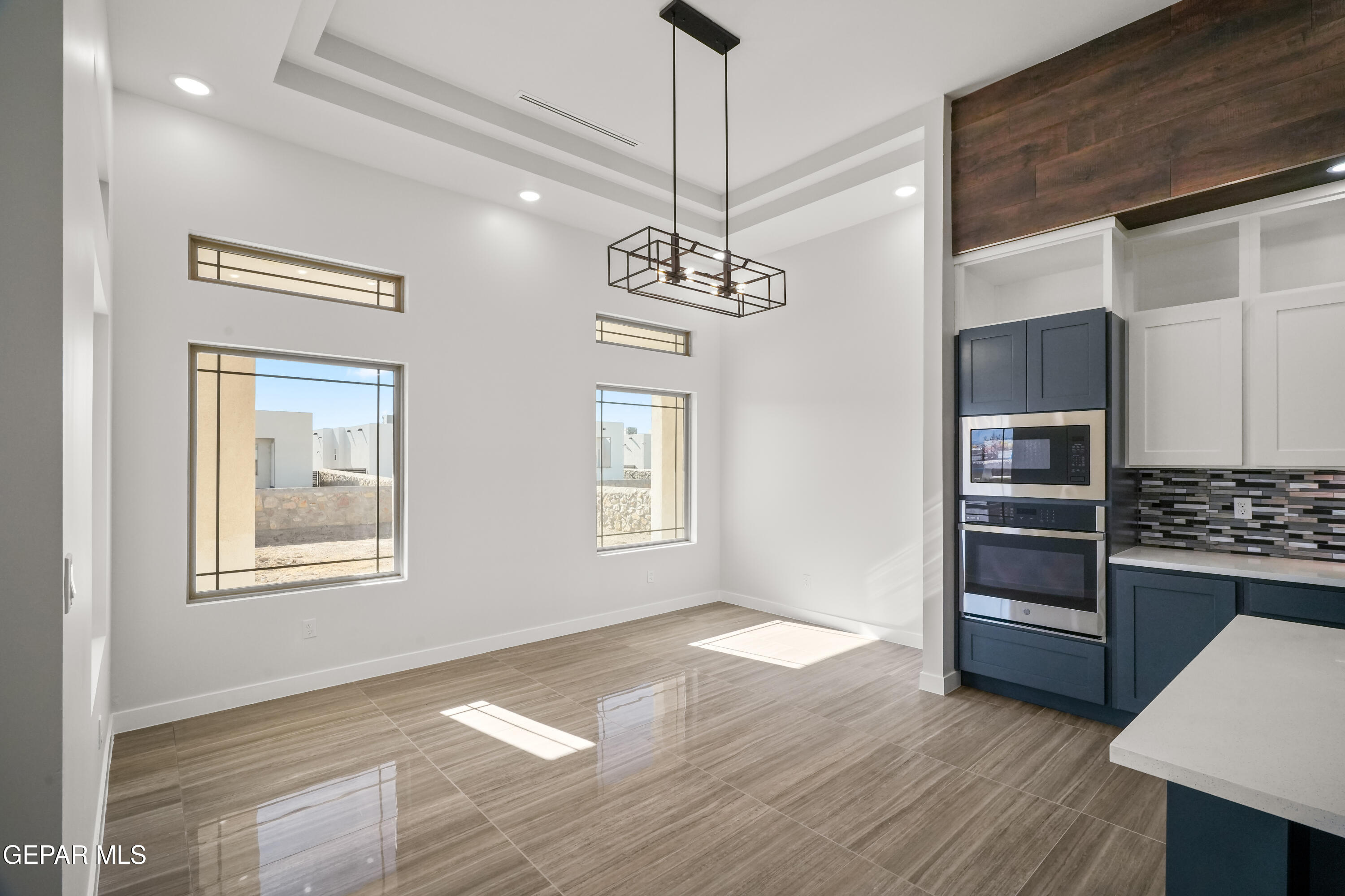 360 Rio De Jazmin Circle El Paso, TX 79932 - Photo 19 of 66 a view of an empty room with a window and wooden floor