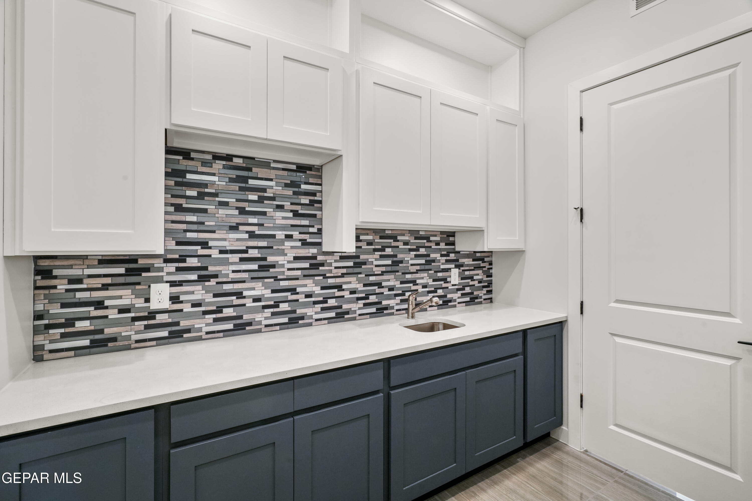 360 Rio De Jazmin Circle El Paso, TX 79932 - Photo 27 of 66 a kitchen with granite countertop white cabinets and white appliances